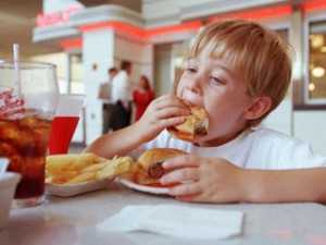Image child eating junk food