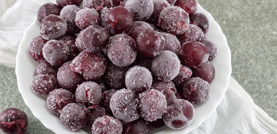 Bowl of frozen grapes