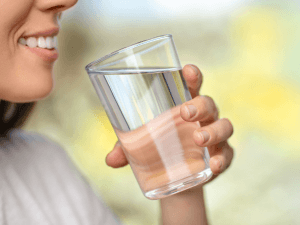 Woman drinking cup of water