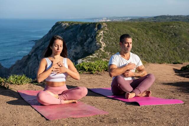 a woman and man practice mindful breathing